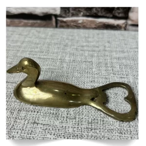 Abrebotellas en forma de pato en bronce dorado
